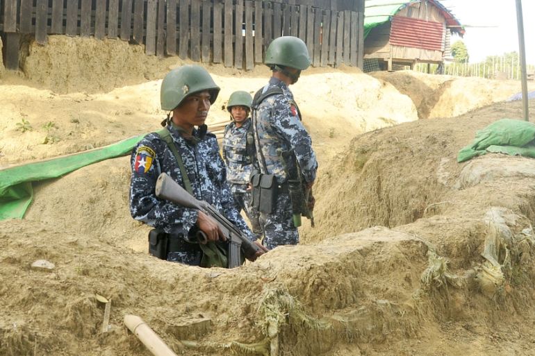 Myanmar border guard police stand guard at Goke Pi outpost in Buthidaung during a government organized media tour in Rakhine