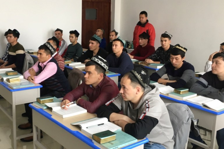 Islamic studies students attend a class at the Xinjiang Islamic Institute during a government organised trip in Urumqi