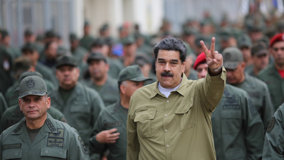 President Nicolas Maduro gestures during a meeting with soldiers at a military base [Reuters]