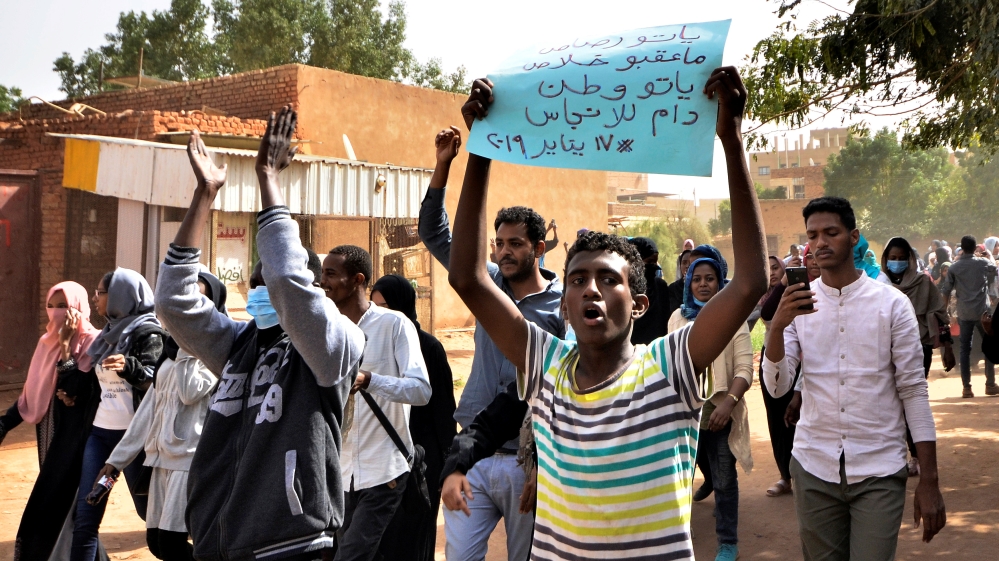 Sudanese demonstrators chant slogans as they participate in anti-government protests in Khartoum [Mohamed Nureldin Abdallah/Reuters]