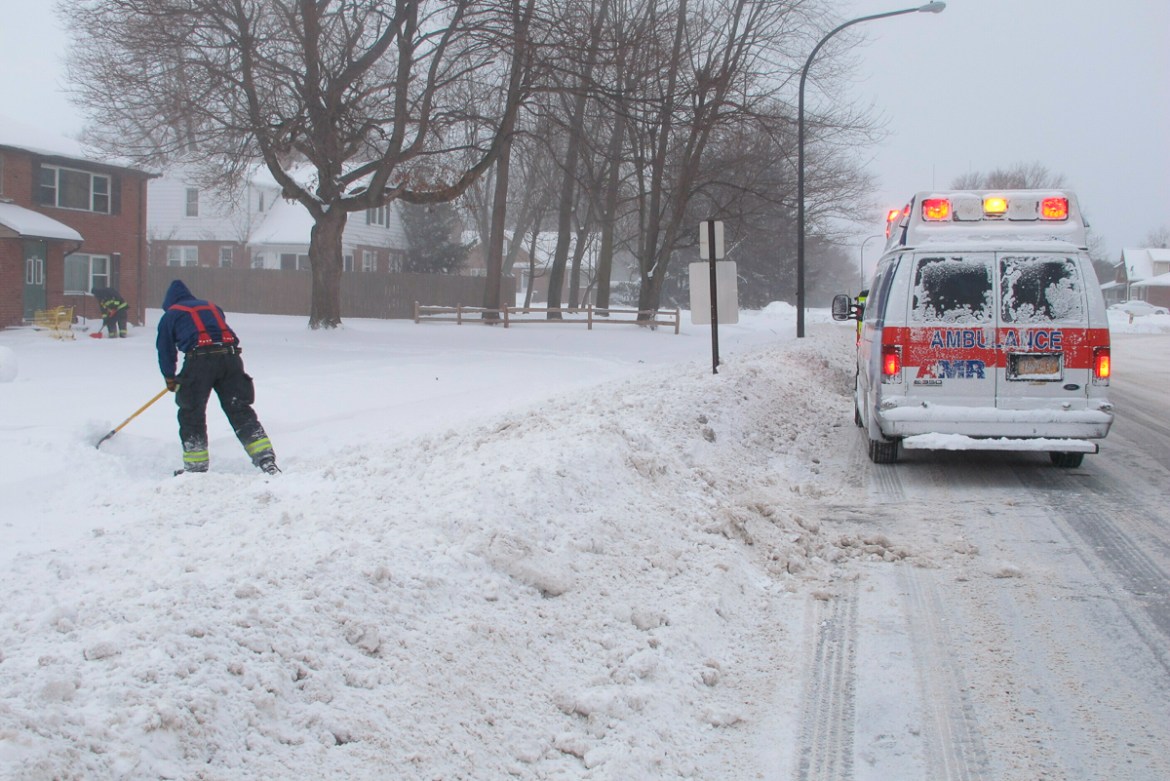 Emergency crews responding to a medical call shovel a path to the woman''s apartment, Wednesday, Jan. 30, 2019 in Lackawanna, New York. The area was under a blizzard warning and officials urged people