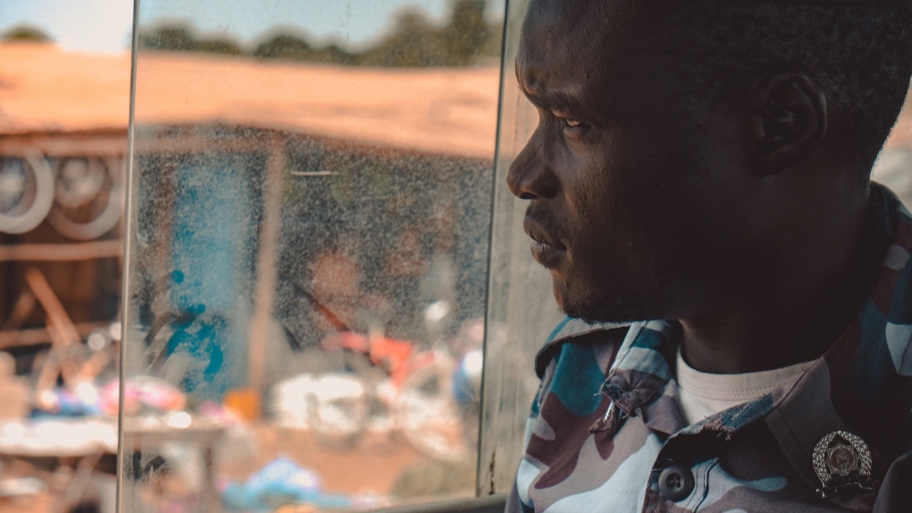 A policeman is on the lookout for possible new patients. He is one of a handful of security forces that help Dr Atong find patients on the streets of Juba [Jasmin Bauomy/Al Jazeera]