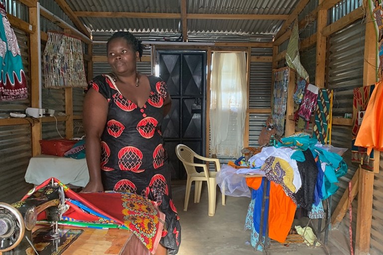 Irene Obahiambo stands in her workshop in Kawangware slum, Nairobi [William Worley/Al Jazeera]