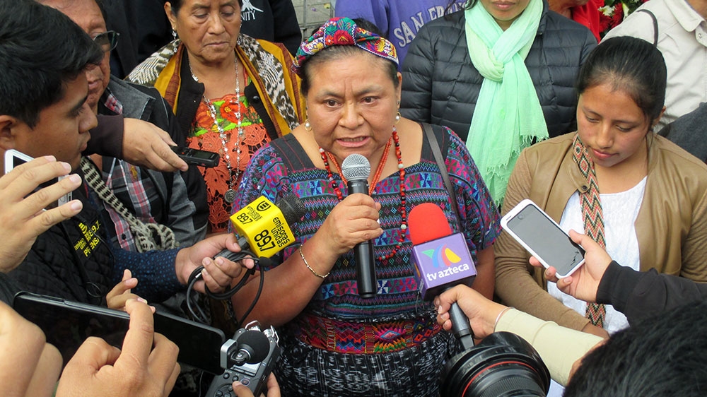 Nobel Peace Prize winner Rigoberta Menchu speaks to reporters after a ceremony at the site of the January 31, 1980 Spanish Embassy massacre in which her father and more than 30 others were killed [Sandra Cuffe/Al Jazeera]