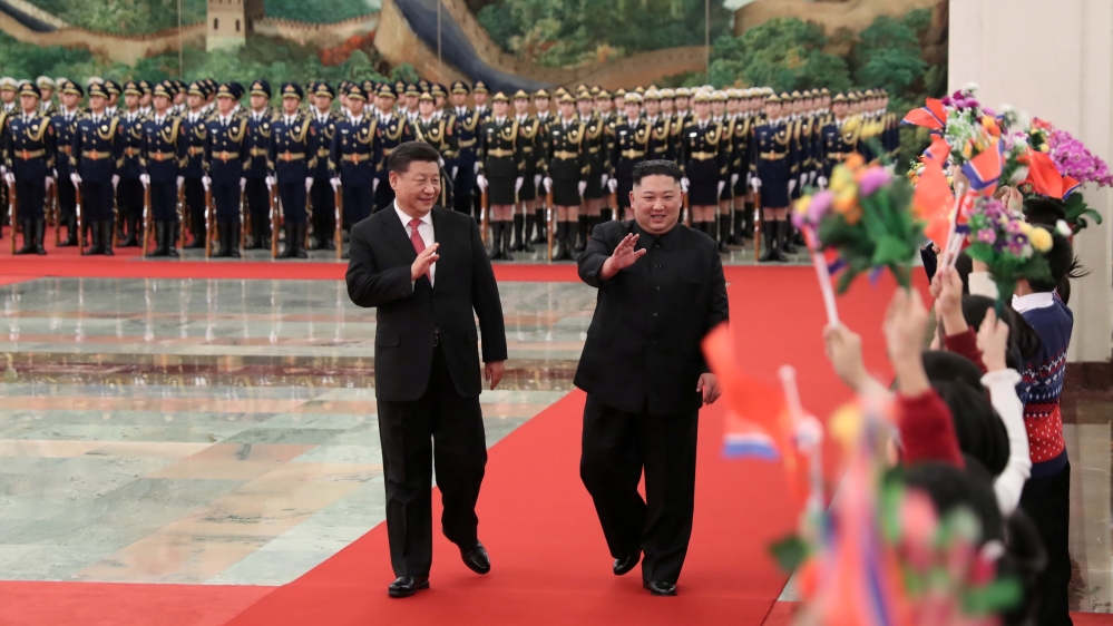 Chinese President Xi Jinping welcomes North Korean leader Kim Jong-un at a ceremony in Beijing [Huang Jingwen/Xinhua via Reuters]