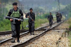Thai soldiers patrol the railroad tracks near Raman district of Yala province