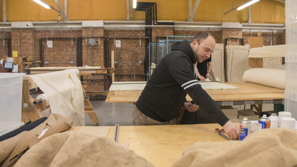 A worker from Romania makes luxury mattresses in London [Ylenia Gostoli/Al Jazeera]