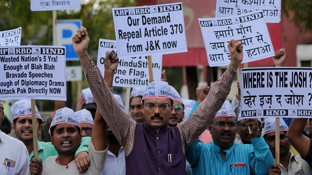 Demonstrators in Ahmedabad demanding to scrap Article 370, a constitutional provision that grants Kashmir special status and allows the state to make its own laws [Amit Dave/Reuters]
