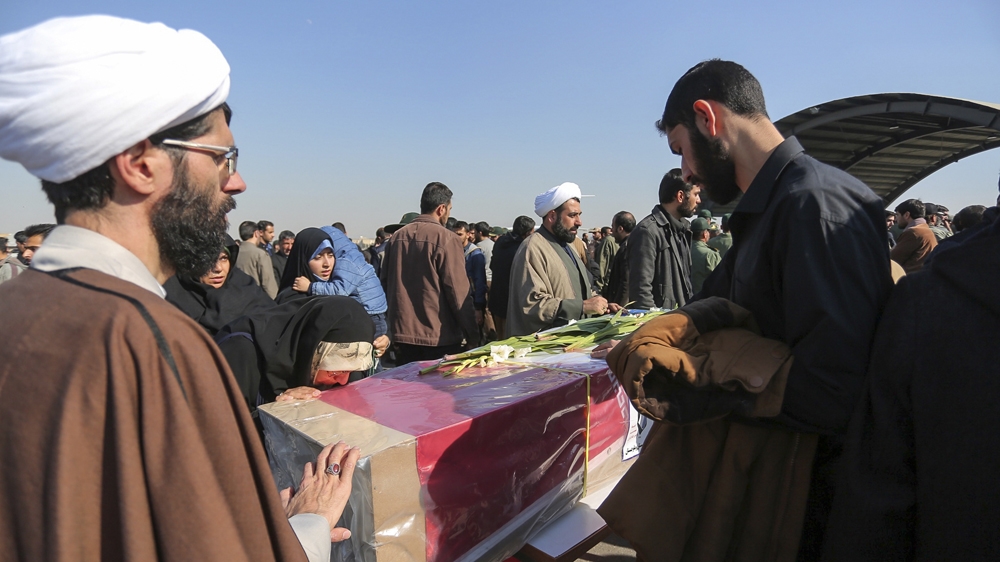 Mourners pay tribute to the Revolutionary Guard members killed on Wednesday [Morteza Salehi/AP]