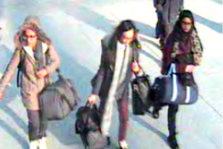 In this still taken from CCTV issued by the Metropolitan Pol in London on Feb. 23, 2015, 15-year-old Amira Abase, left, Kadiza Sultana,16, center, and Shamima Begum, 15, walk through Gatwick airport,