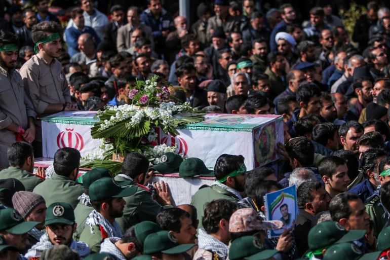 Members of Iran''s elite Revolutionary Guards, gather around the coffins of their fellow guards, who were killed by a suicide car bomb, during the funerals in Isfahan, Iran February 16, 2019