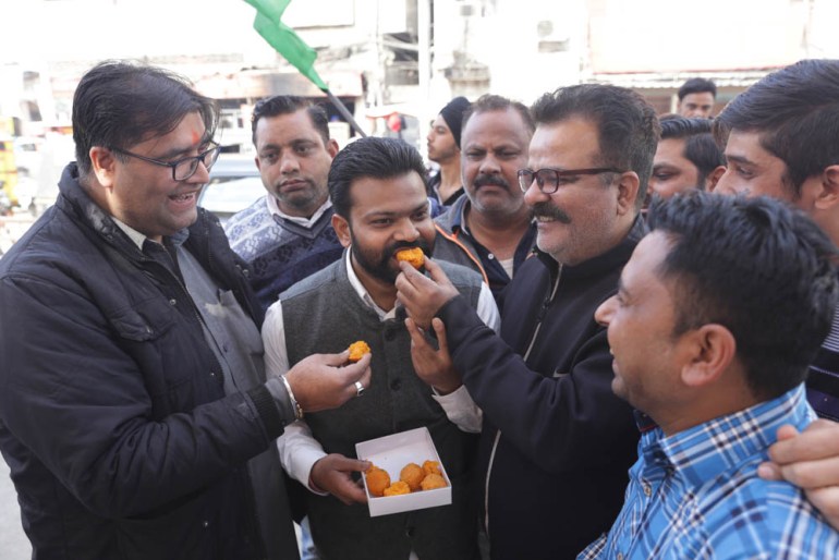Indian people offer sweets to each other as they celebrate the Indian Air Force''s air strike across the Line of Control (LoC) near international border with Pakistan; in Amritsar, India, 26 February 2
