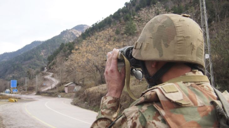A Pakistani soldier watch movement of Indian forces along the Line of Control from a Chakoti post, 50 kilometers from Muzaffarabad, capital of Pakistani Kashmir on Saturday, Feb. 23, 2019. Pakistan''s