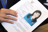 Thai Raksa Chart Party leader holds up candidacy application of Thailand's Princess Ubolratana at the Election Commission office in Bangkok, February 8, 2019 [Athit Perawongmetha/Reuters]