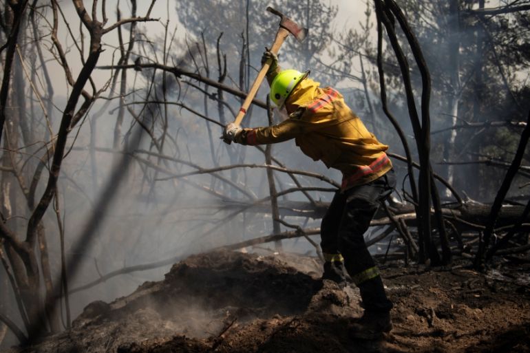 New Zealand Defence Force firefighters combat the Richmond fire near Nelson, New Zealand
