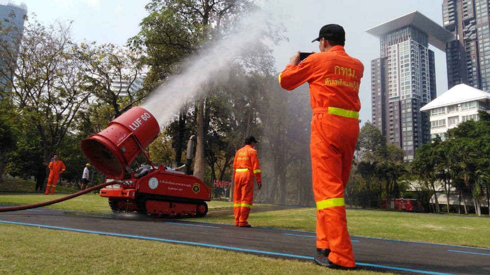 Thailand deployed water cannon and drones to a local park in Bangkok to try and disperse the toxic smog that's been hanging over the city for weeks [Caleb Quinley/Al Jazeera]