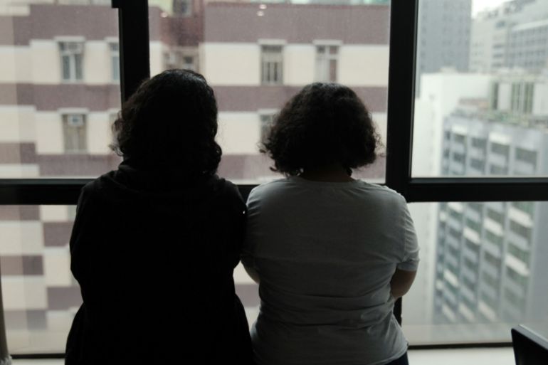 Sisters from Saudi Arabia, who go by aliases Reem and Rawan, are pictured at their lawyer Michael Vidler''s office in Hong Kong