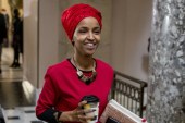Congresswoman Ilhan Omar walks through the halls of the Capitol Building in Washington on January 16, 2019 [File: Andrew Harnik/AP]