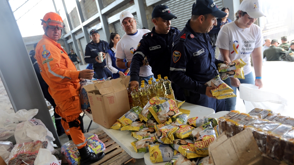 The goods, including packaged corn, flour, lentils and cans of tuna, arrived a day earlier at the Colombian border city of Cucuta [Luisa Gonzalez/Reuters]