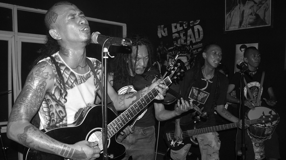 Indonesian punk band Marjinal performing on stage [Ian Wilson/Al Jazeera]
