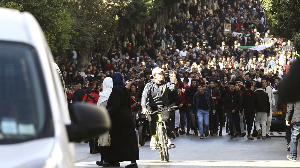 Demonstrators in Algiers marched against Bouteflika's reelection bid for fifth term. [Anis Belghoul/AP]