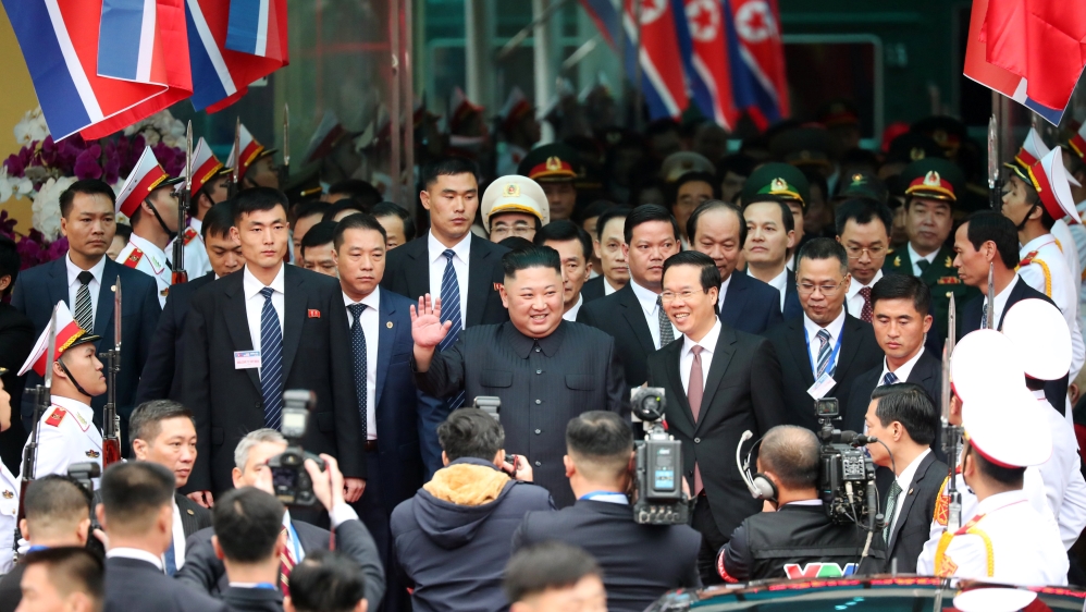 Kim is greeted by Vietnamese officials and a gathered crowd [Athit Perawongmetha/Reuters]