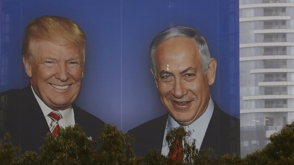 An election campaign billboard in Tel Aviv shows Prime Minister Netanyahu and US President Donald Trump [File: Ariel Schalit/AP]