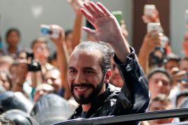 Presidential candidate Nayib Bukele of the Great National Alliance (GANA) waves after casting his vote in a presidential election in San Salvador