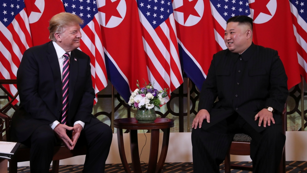 U.S. President Donald Trump and North Korean leader Kim Jong Un sit down before their one-on-one chat during the second US-North Korea summit at the Metropole Hotel in Hanoi. [Leah Millis/Reuters]