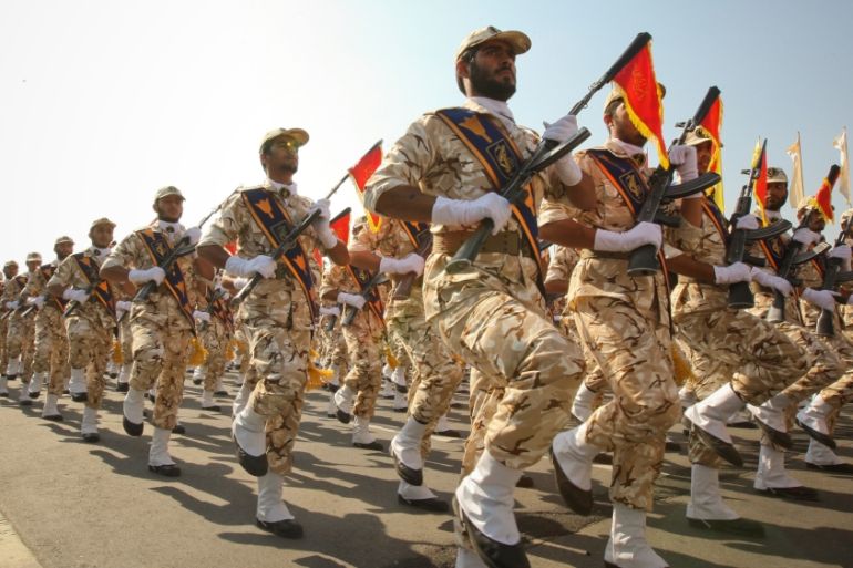 Members of the Iranian revolutionary guard march during a parade to commemorate the anniversary of the Iran-Iraq war (1980-88), in Tehran