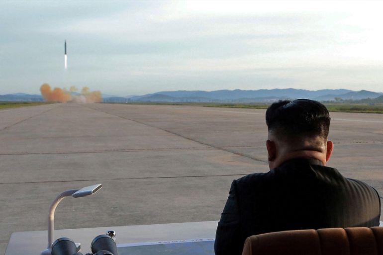 Kim Jong Un watches the launch of a Hwasong-12 missile in an undated photo that was released in September 2017 [Reuters]