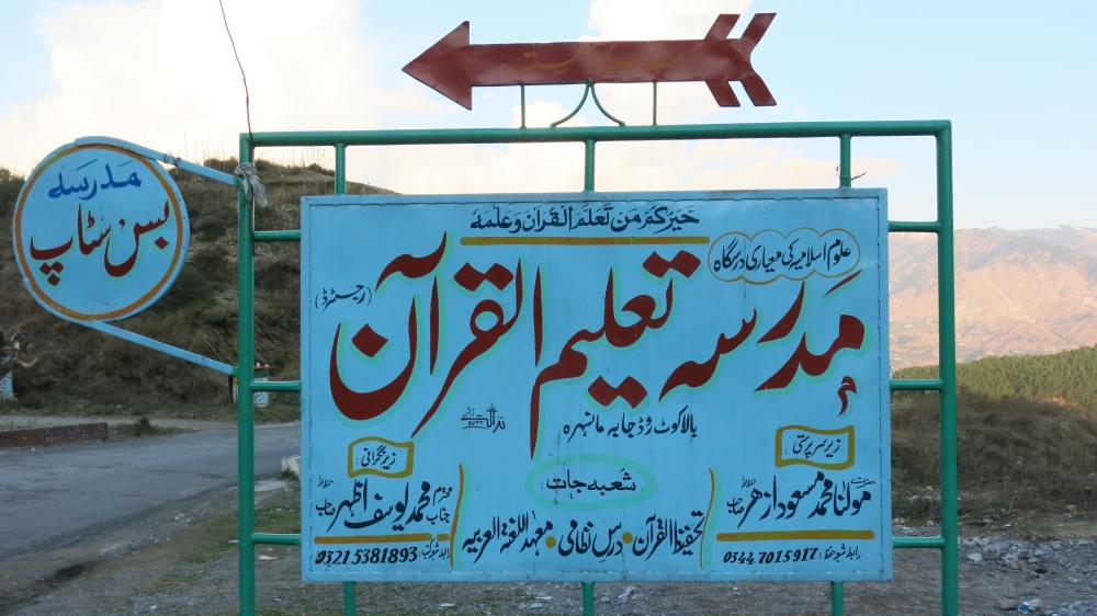 The signboard lists JeM founder and chief Masood Azhar as its 'leader', and wanted-JeM associate Yousuf Azhar as its 'administrator'[Asad Hashim/Al Jazeera]