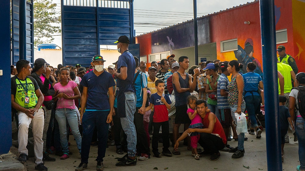 Venezuelans wait in line at a soup kitchen in Cucuta [Mia Alberti/Al Jazeera] 