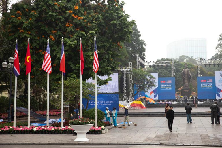 The square opposite the Hoan Kiem Lake in Hanoi is hosting an exhibition but also providing locals and tourists a photo spot with the Us, North Korean and Vietnamese flags. [Faras  Ghani/Al Jazeera]
