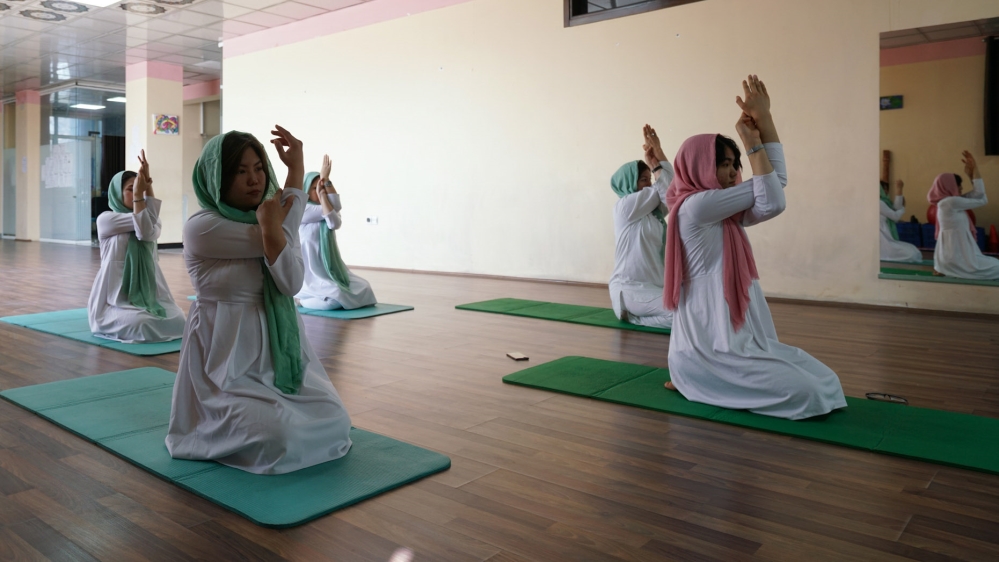 The lack of security and the perception that yoga is unIslamic are two main challenges for women attending classes [Sorin Furcoi/Al Jazeera]