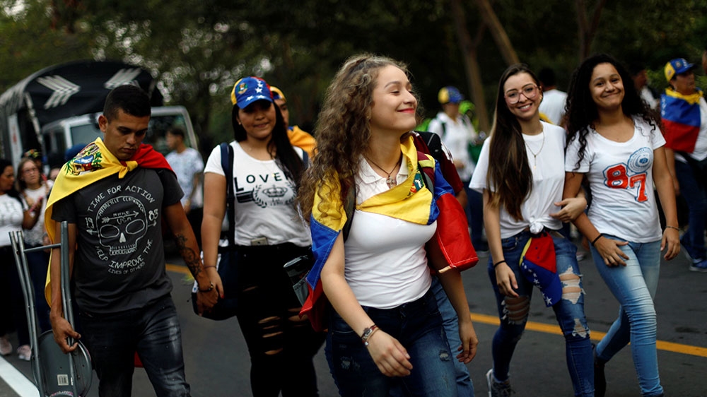 People arrive at the Venezuela Live Aid concert at the Tienditas cross-border bridge between Colombia and Venezuela, in Cucuta, Colombia [Edgard Garrido/Reuters] 