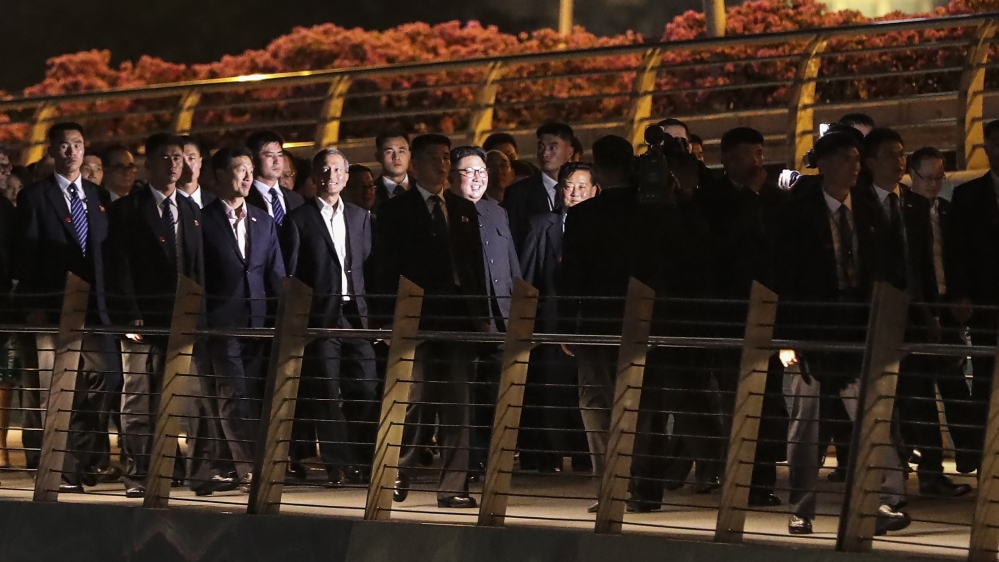 Kim and his entourage visiting Singapore's Marina Bay [File:Yong Teck Lim/AP Photo]