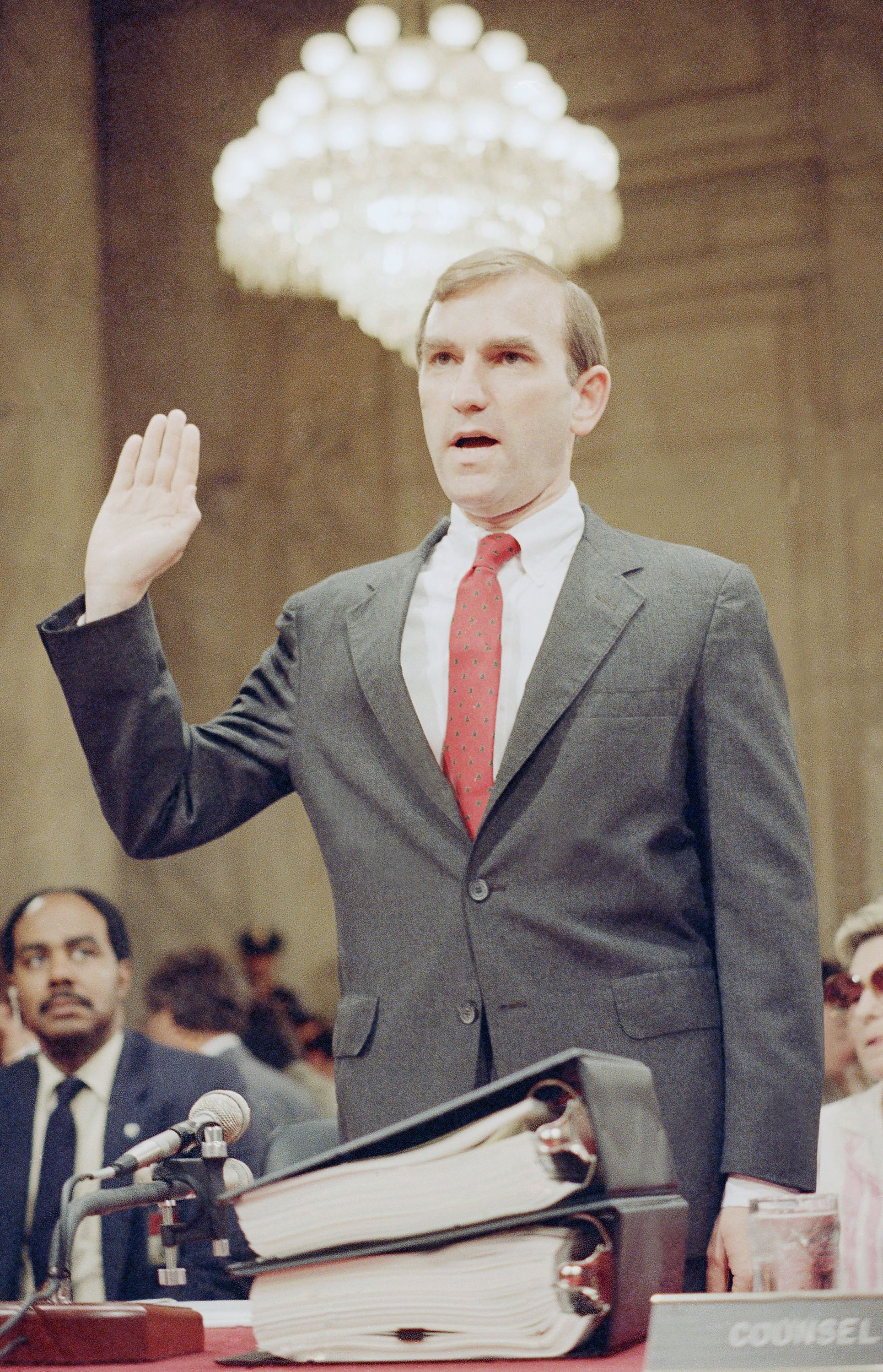 Assistant Secretary of State Elliott Abrams is sworn in prior to testifying before a joint Senate-House Committee in Washington, DC, on June 2, 1987 [Lama Harris/AP Photo]
