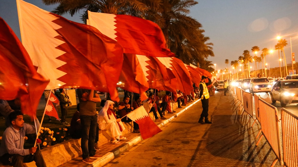 Residents gather on the Corniche to welcome the Qatar national team [Showkat Shafi/Al Jazeera]