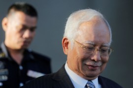 Former Prime Minister Najib Razak walks out of Kuala Lumpur High Court in Kuala Lumpur, Malaysia