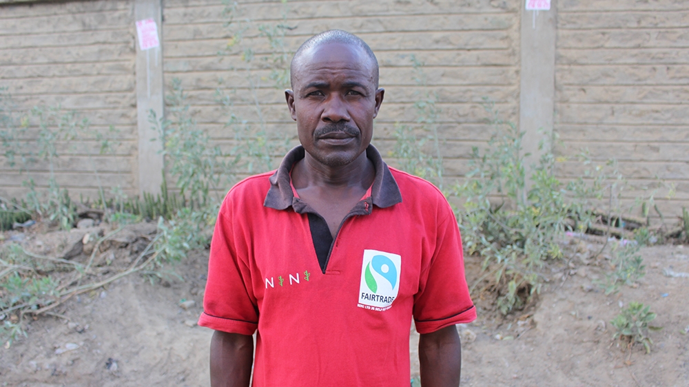 Leonard Karani, a flower farm worker and father of six, said he hadn't had enough money to continue his education [Osman Mohamed Osman/Al Jazeera]