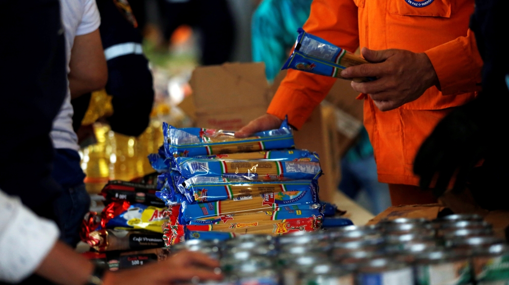 Workers organise humanitarian aid for Venezuela [Luisa Gonzalez/Reuters]
