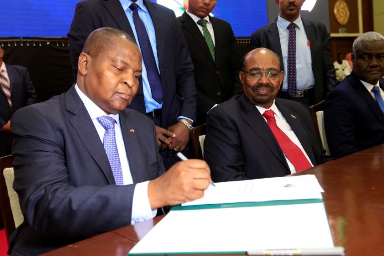 Central African Republic President Faustin Archange Touadera signs a peace deal between the Central African Republic government and 14 armed groups in Khartoum