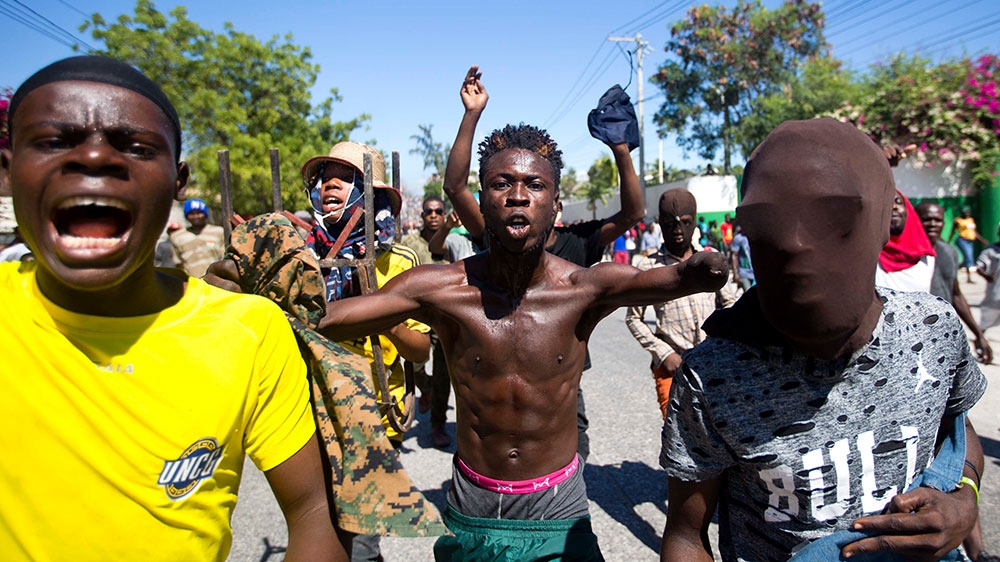 Protesters chant anti-government slogans demanding the resignation of President Jovenel Moise in Port-au-Prince, Haiti [Dieu Nalio Chery/AP Photo] 