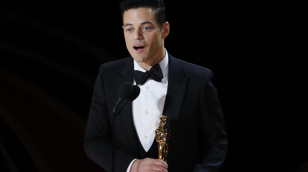 Rami Malek accepts the Best Actor award for his role in Bohemian Rhapsody [Mike Blake/Reuters]
