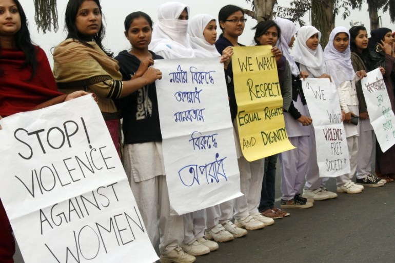 Hundreds of Bangladeshi women activists stand before the national parliament building to protest crime against women in Dhaka, Bangladesh, Thursday, Jan. 10, 2013. Indian police have badly beaten the