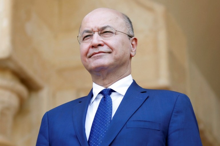 Barham Salih, Iraq''s newly elected President stands during a handover ceremony at Salam Palace in Baghdad