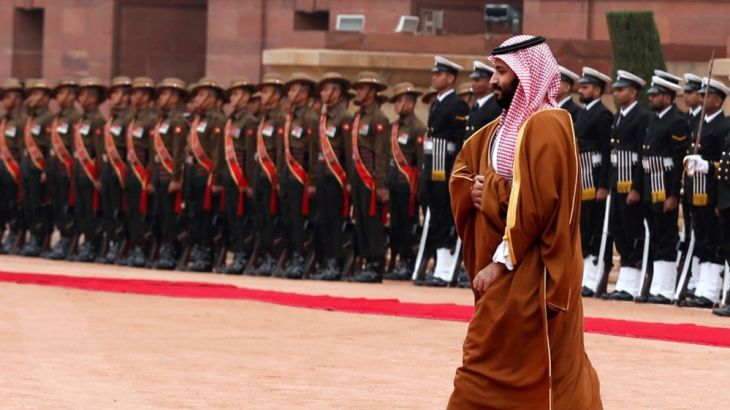 Saudi Arabia''s Crown Prince Mohammed bin Salman walks back after inspecting an honour guard during his ceremonial reception at the forecourt of Rashtrapati Bhavan presidential palace in New Delhi