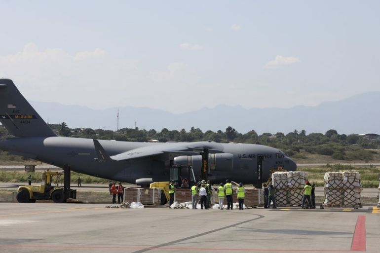 Humanitarian aid is unloaded from an United States Air Force C-17 cargo plane, at Camilo Daza airport in Cucuta, Colombia, Saturday, Feb. 16, 2019.