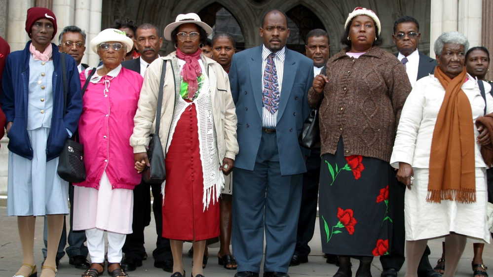 A group of refugees from the Indian Ocean island of Chagos gather outside the High Court in London on October 31, 2002. They are seeking compensation from the British government for forcibly removing them to make way for the Diego Garcia US military base 30 years ago [Reuters/Michael Crabtree]